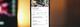 Smartphone met restaurantmenu op een online bezorgapp getoond tegen een warme, onscherpe achtergrond met bokeh-effect