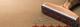 Houten stempel met vijf rode sterren afgedrukt op bruin papier, met paperclip ernaast - symbool voor kwaliteitsbeoordeling