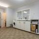 Grote, energiezuinige woning met drie slaapkamers, garage en atelier op een zonnig perceel