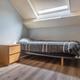Grote, energiezuinige woning met drie slaapkamers, garage en atelier op een zonnig perceel
