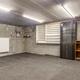 Grote, energiezuinige woning met drie slaapkamers, garage en atelier op een zonnig perceel