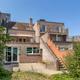Grote, energiezuinige woning met drie slaapkamers, garage en atelier op een zonnig perceel