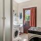 Woning met 3 slaapkamers, inpandige garage en weidse tuin