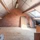 Grote, energiezuinige woning met drie slaapkamers, garage en atelier op een zonnig perceel