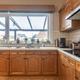 Ruime bel-etage woning met 3 slaapkamers en inpandige garage op perceel van 11a 61ca
