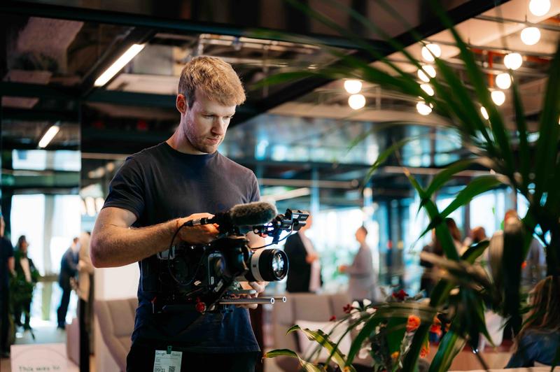 Videographer during shoot at Google Amsterdam office Our videographer at work